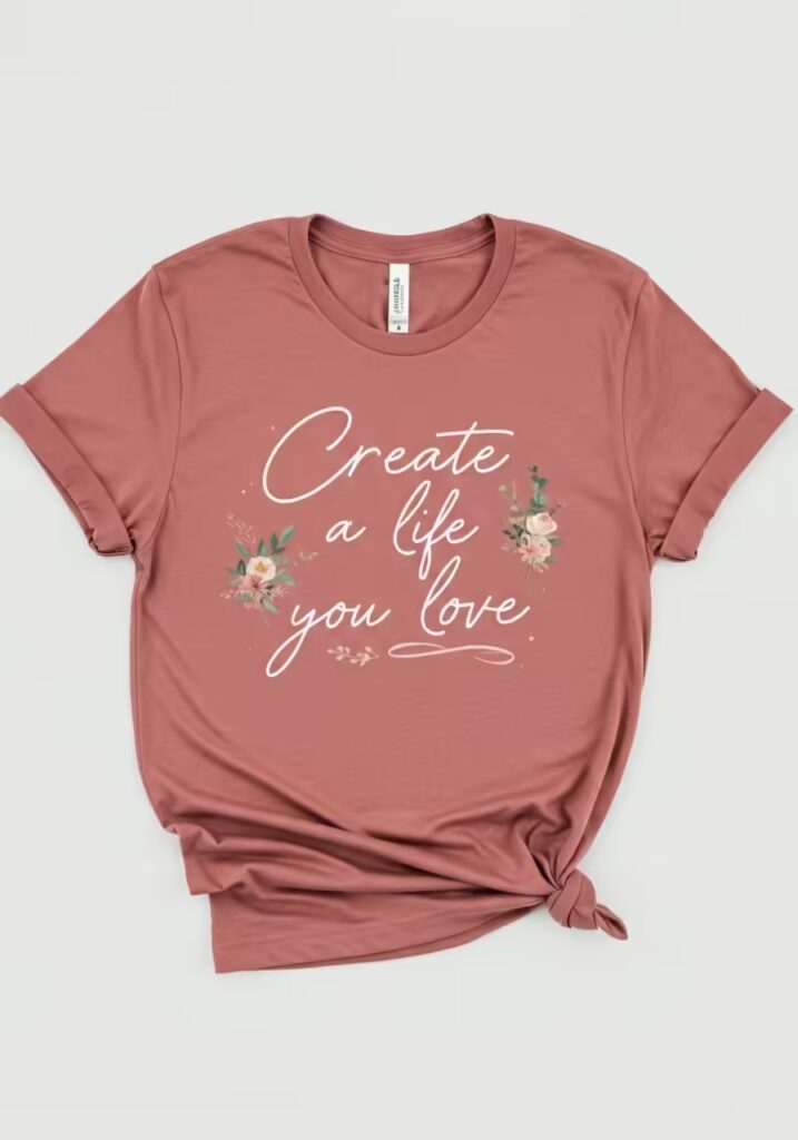 An elegant t-shirt with an inspirational quote combining script and sans-serif fonts.