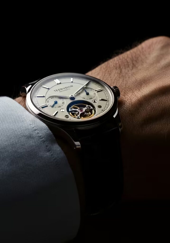 25 Best Gift Ideas for Dads Who Have Everything 8 A close-up shot of a classic, elegant automatic watch on a man's wrist.
